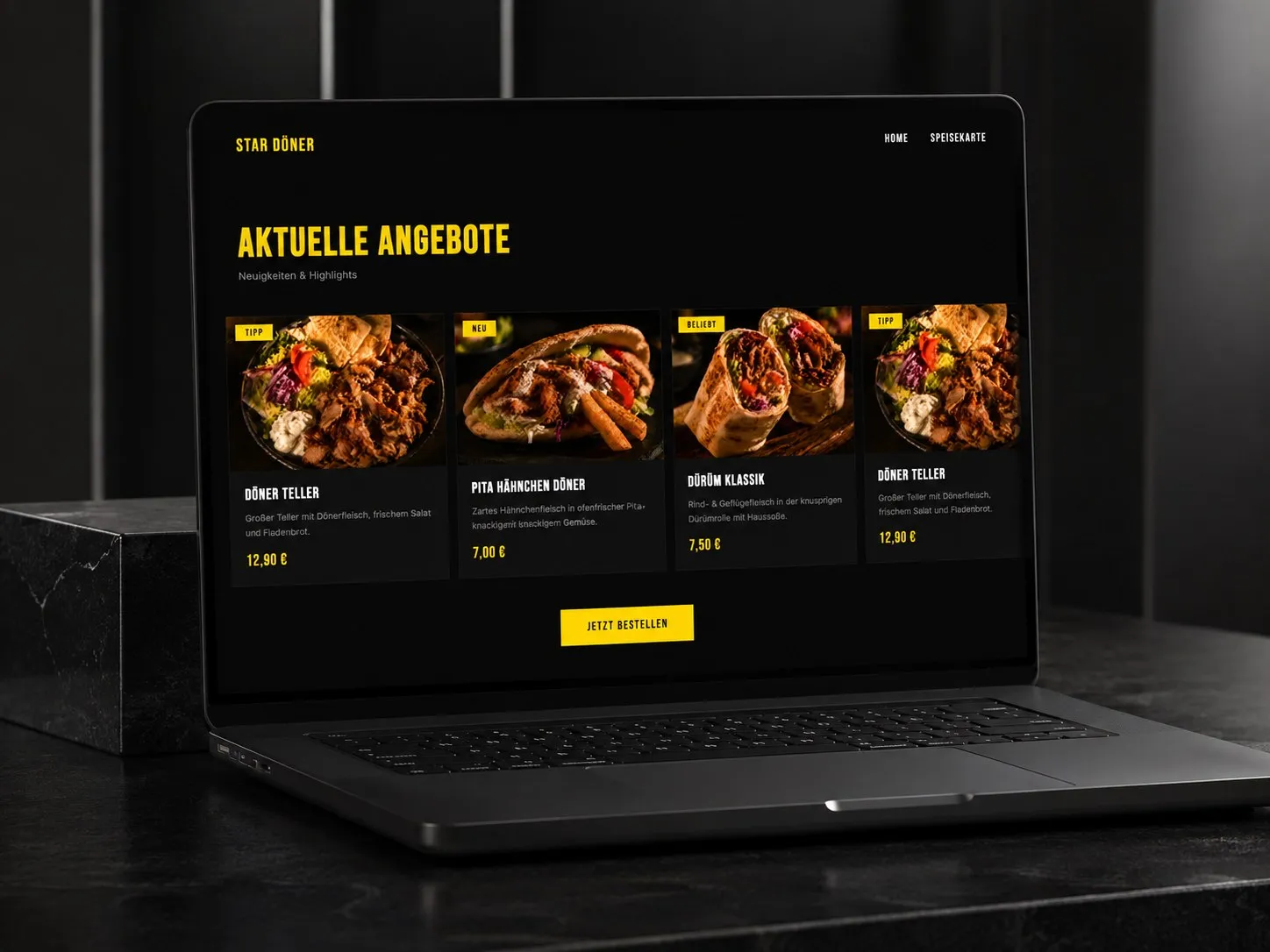 Website von Star Döner auf einem Laptop: dunkle Seite mit gelber Schrift, darunter vier Gerichte mit Preisen unter „Aktuelle Angebote“.